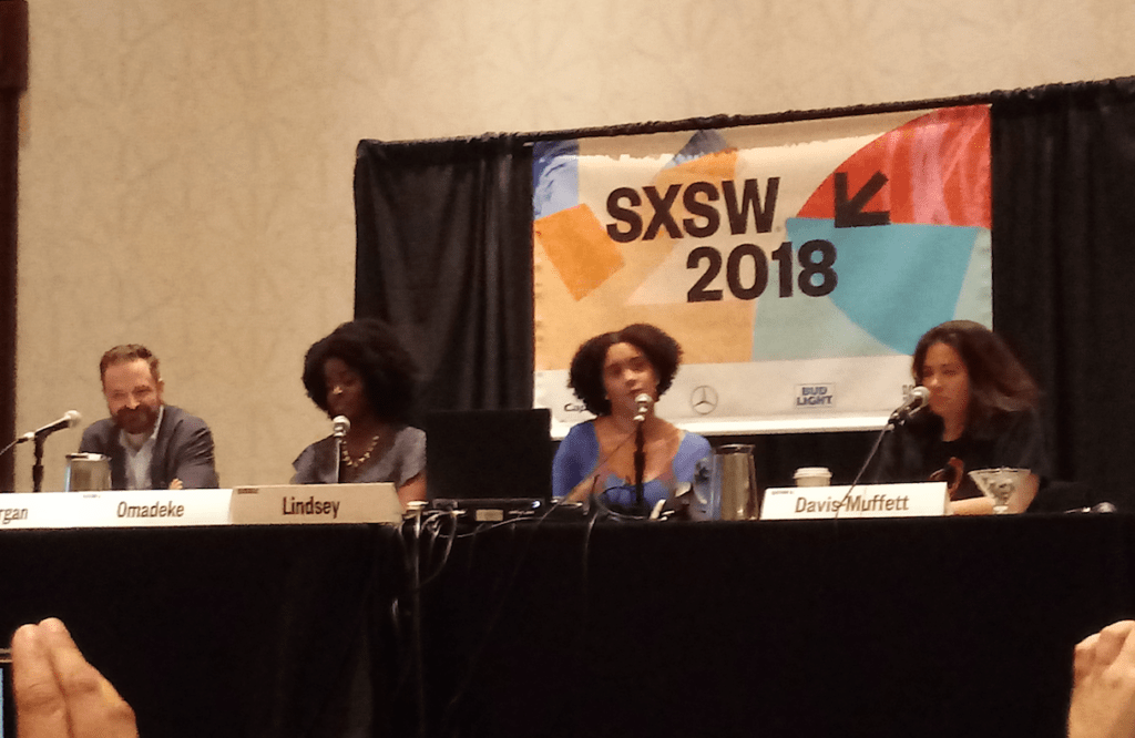 Four people sitting on a SXSW panel on diversity