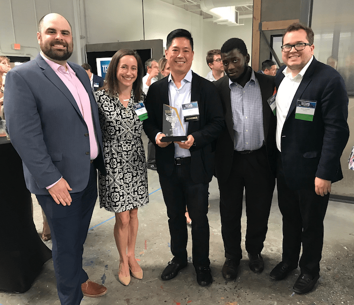 Five Catalyte employees celebrate the Tech 10 Award