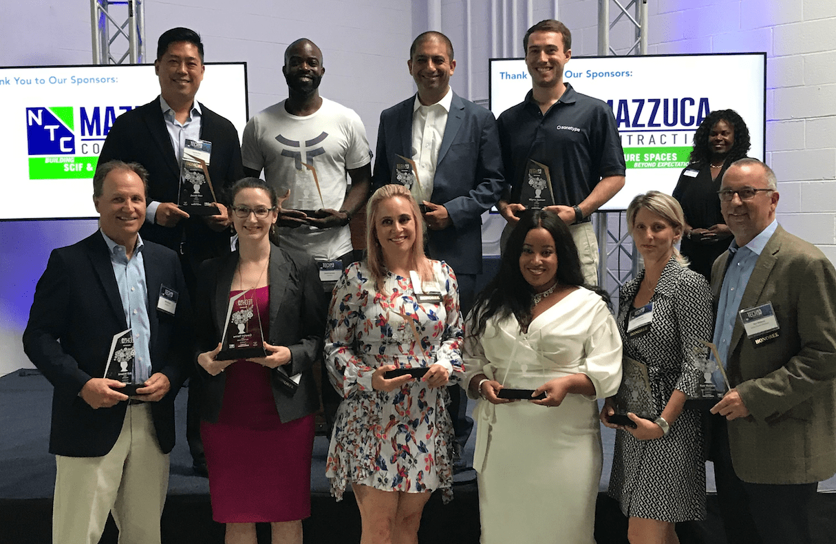 Group shot of 10 executives with the BBJ Tech 10 awards