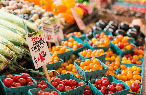 Cartons of tomatoes at a farmer's market