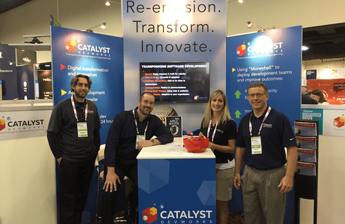 4 Catalyte employees stand at booth at Gartner Symposium conference