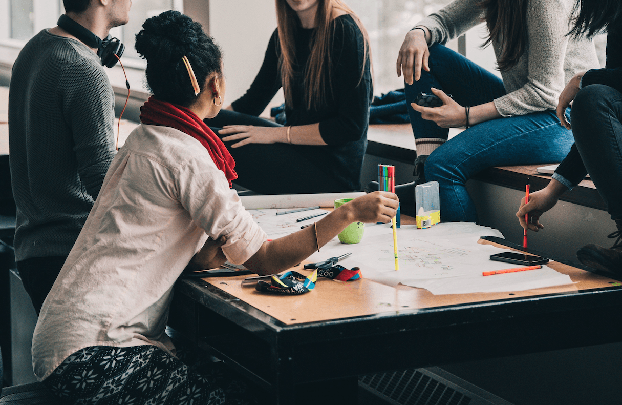 Group of young designers working on a collective project